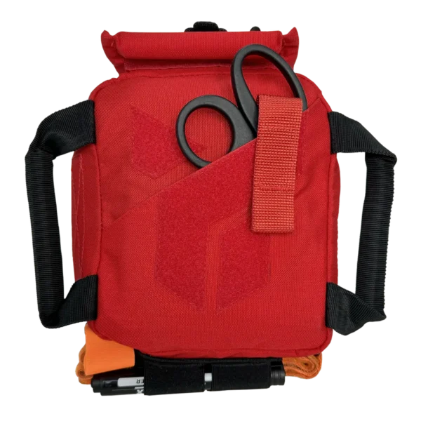 Custodia medica portatile DNIPRO RM29 rossa vista frontale con doppia maniglia di trasporto, tasca esterna per forbici da trauma e pannello in velcro per identificazione del kit di pronto soccorso.